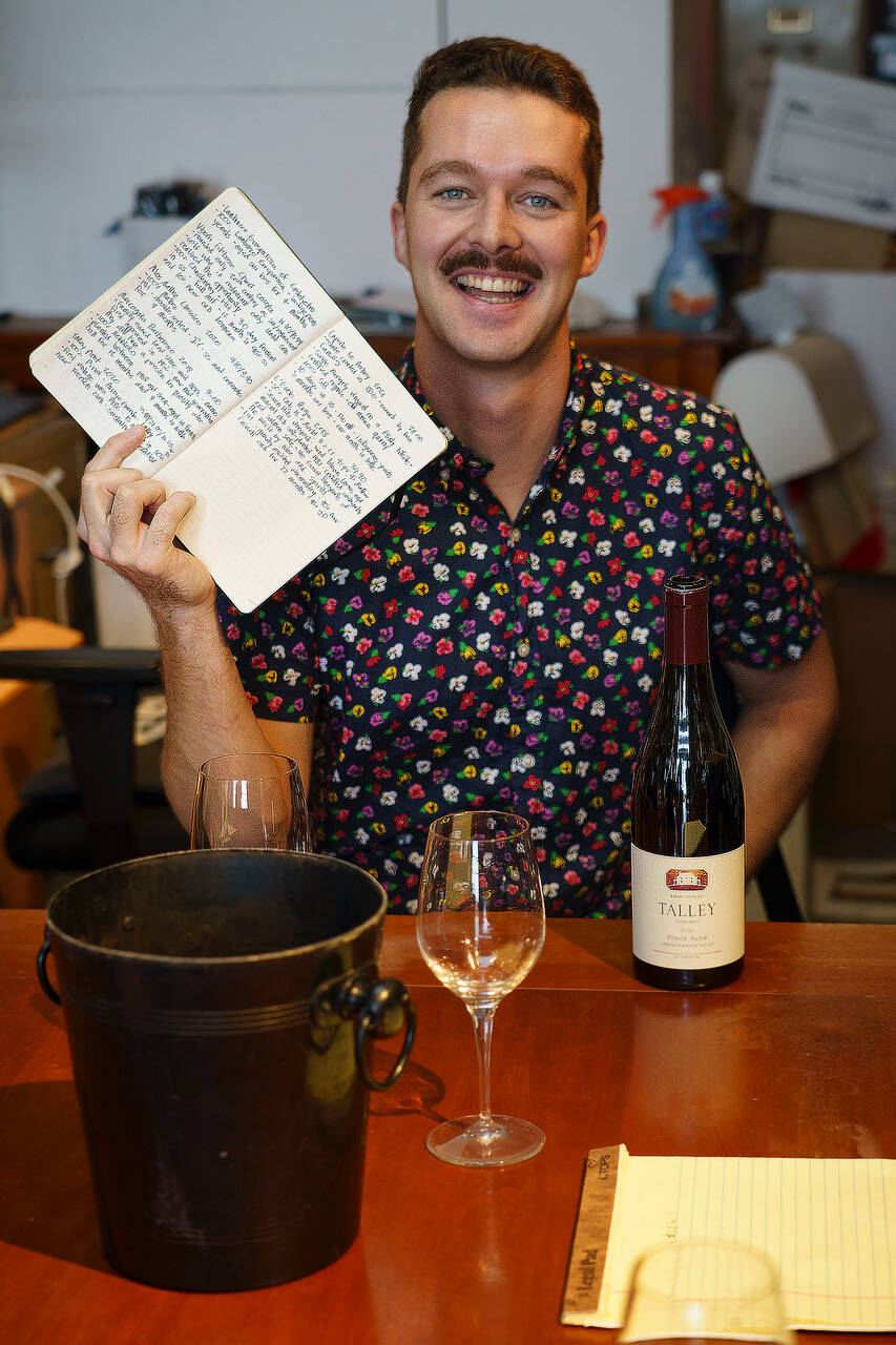 Photo by David Welton
Wine vendor Elliott Allen comes prepared to the Star Store, with a copious amount of notes about each wine he brings the employees for tasting.
