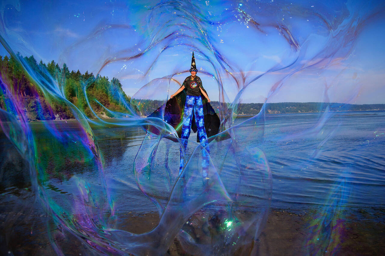 Photo by David Welton
A man on Whidbey Island dressed as a wizard blows bubbles.