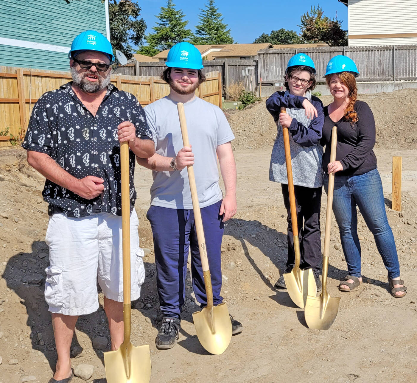 The family breaks ground on their new home with room for everyone.
