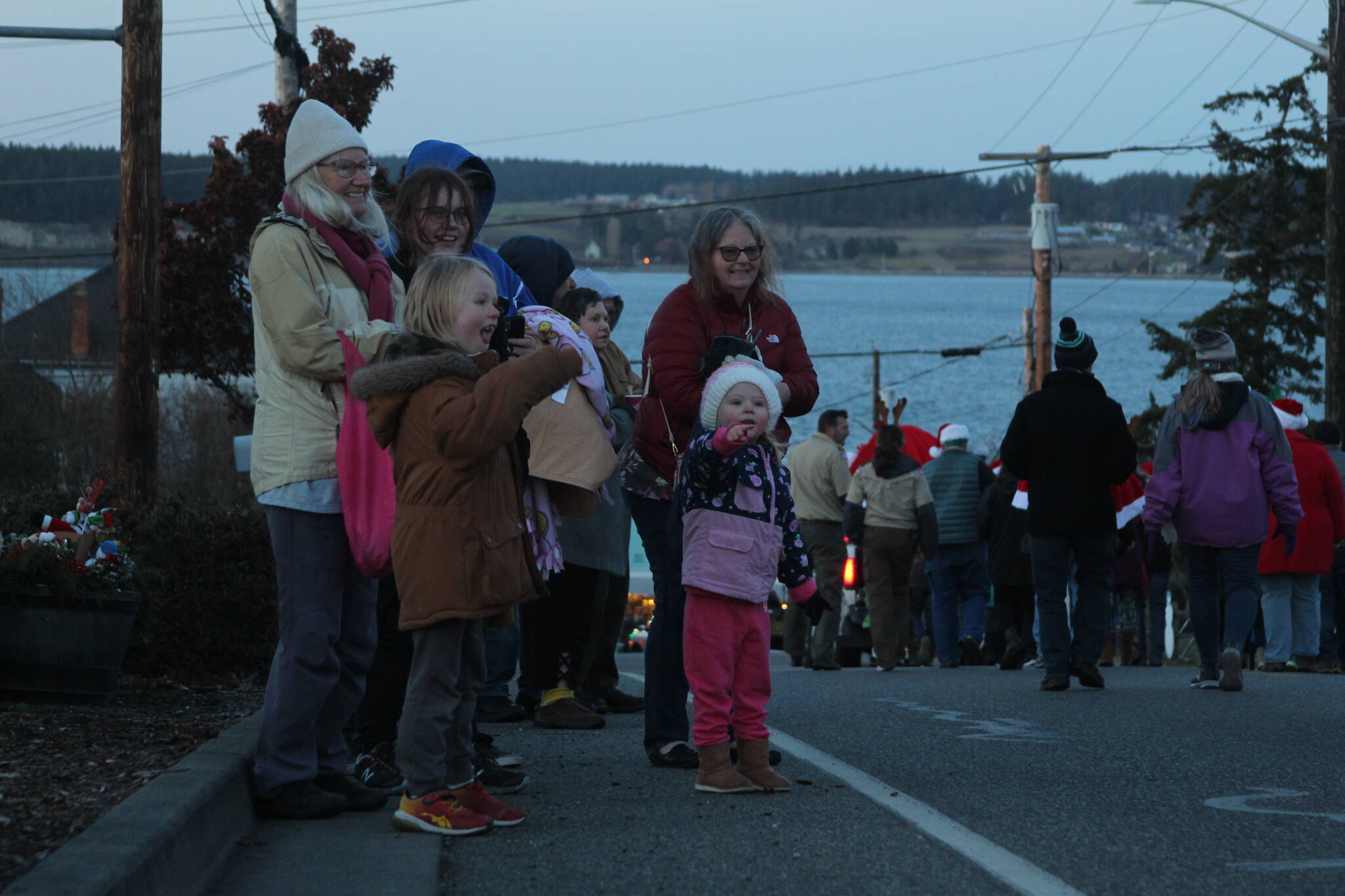 Photo by Karina Andrew/Whidbey News-Times
Paul Stanwood, age 6, and Riley Merryman, 3, eagerly await the appearance of Santa Claus in the Coupeville parade.