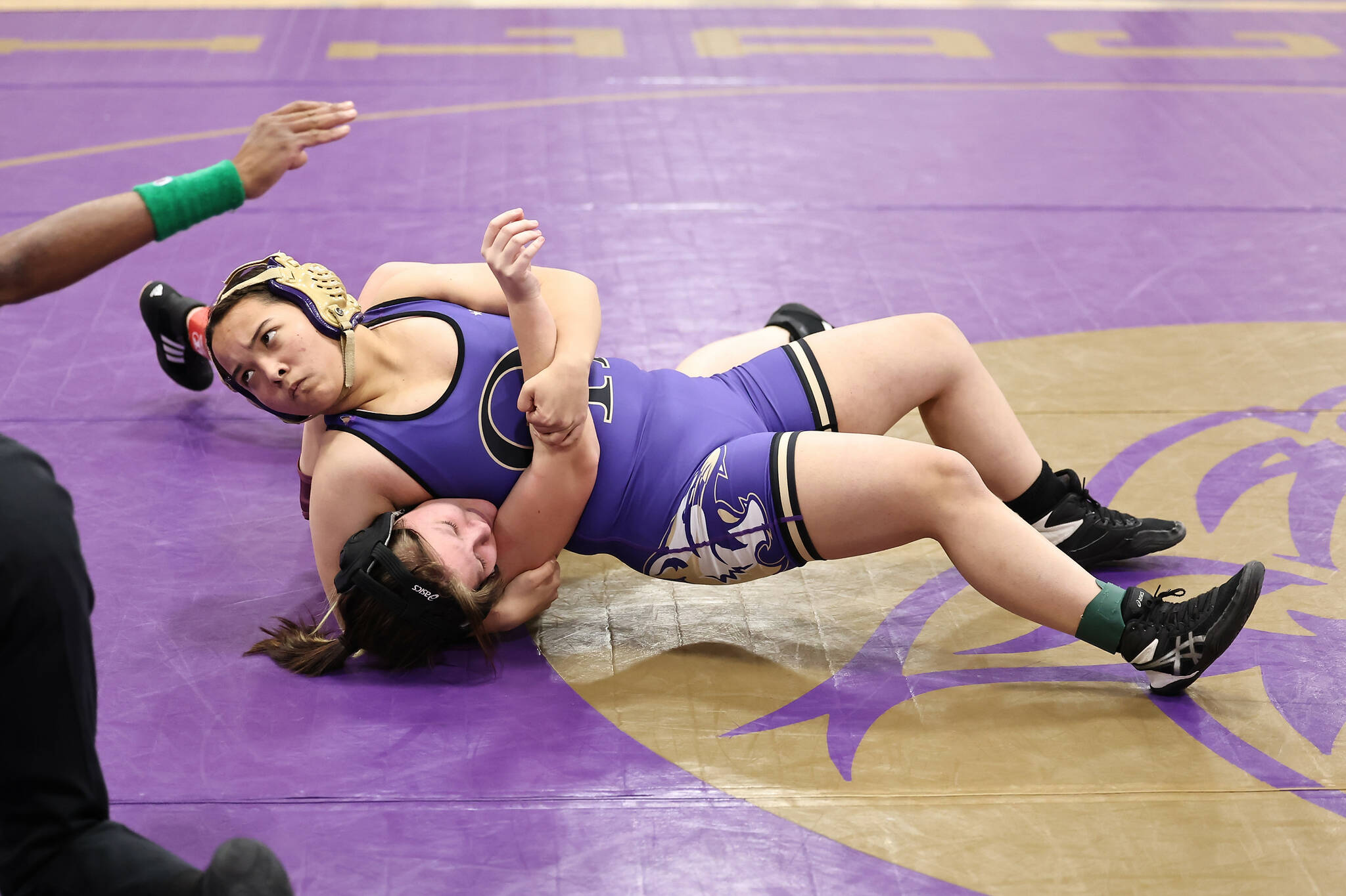Photo by John Fisken
Oak Harbor student athlete Johanna Cisco pins down an opponent from Lakewood at a Dec. 7 wrestling match. Oak Harbor defeated Lakewood 66-12 at the first competition of the season.