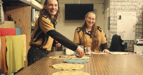 Photo by Karina Andrew/Whidbey News-Times
Shea Looijen, left, and Kristi Uhles assemble their house made pouch games, many of which are recreations of ancient games that have been all but lost over the centuries.