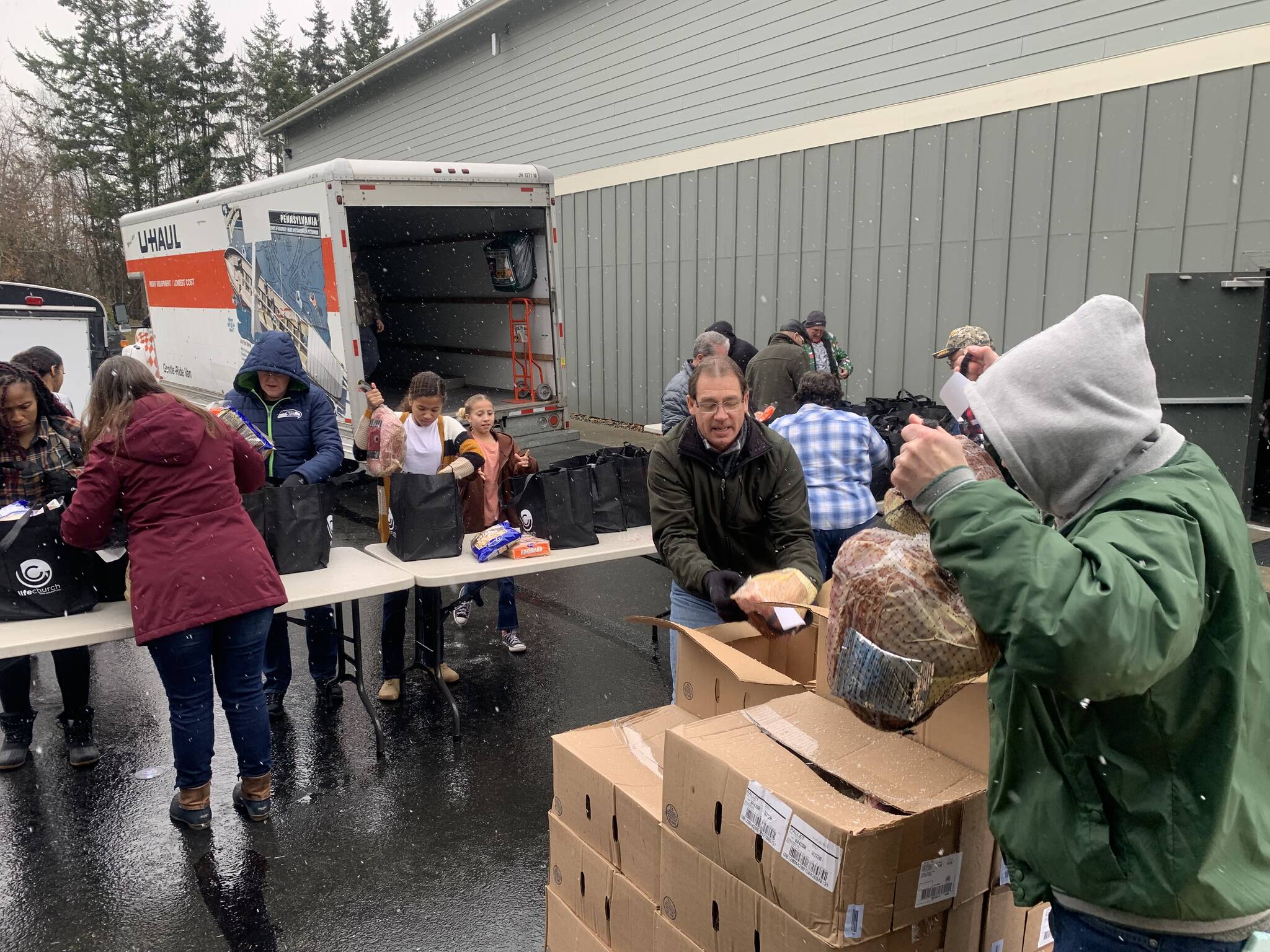 Life Church volunteers brave the cold last weekend to distribute Christmas meals to families in need. (Photo provided)