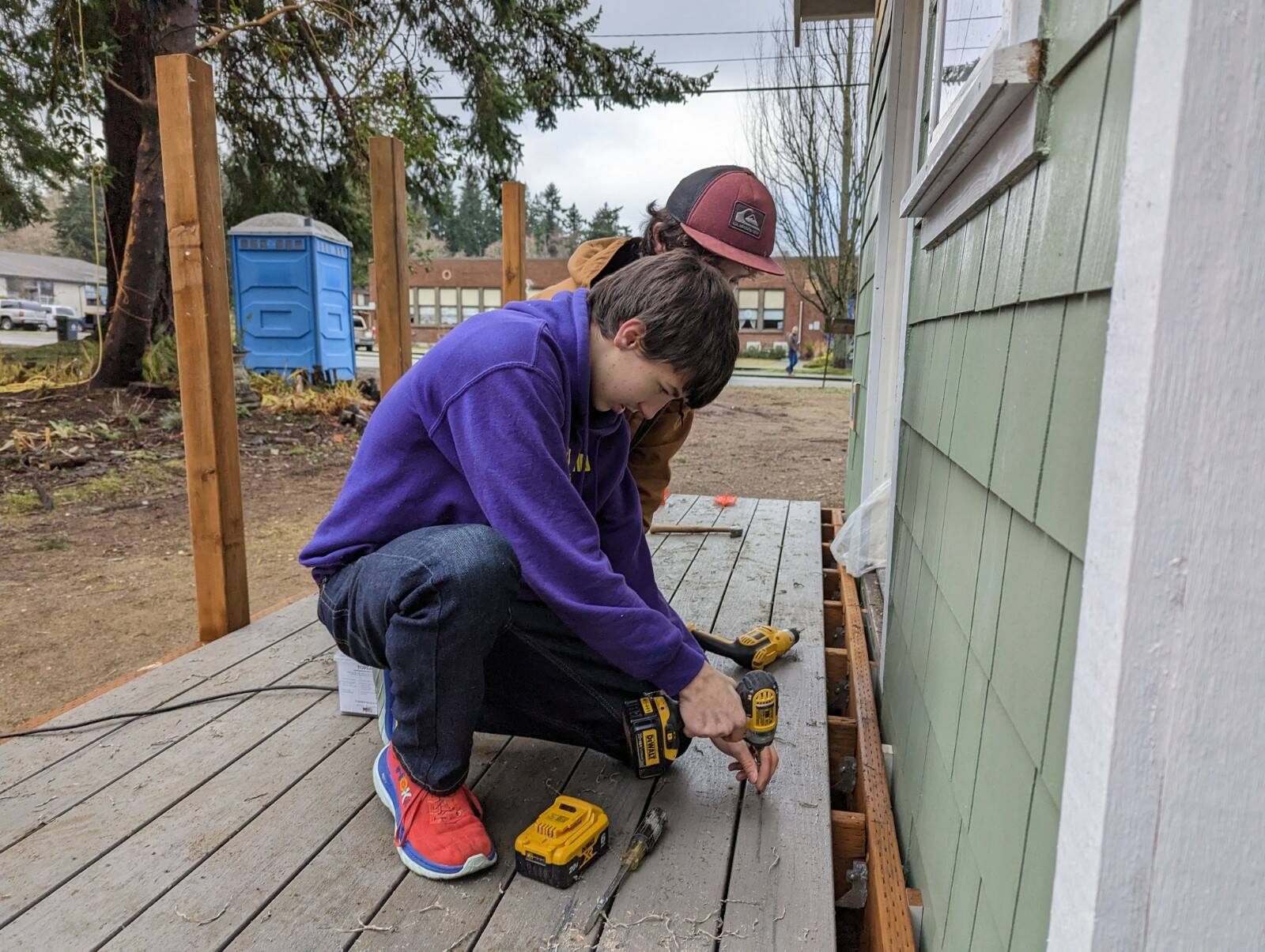 Photo provided
Masyn Eberhardy and Jack Rafferty from Oak Harbor build a deck for one of the tiny homes in Langley.