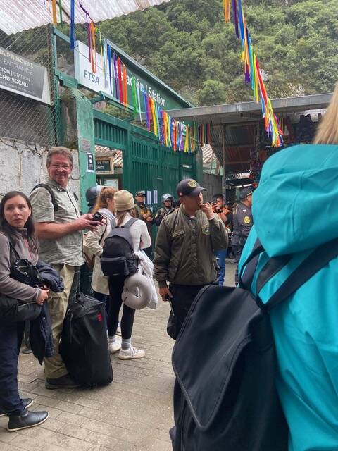 Tourists wait in line to board the train out of Aguas Calientes. (Photo provided)