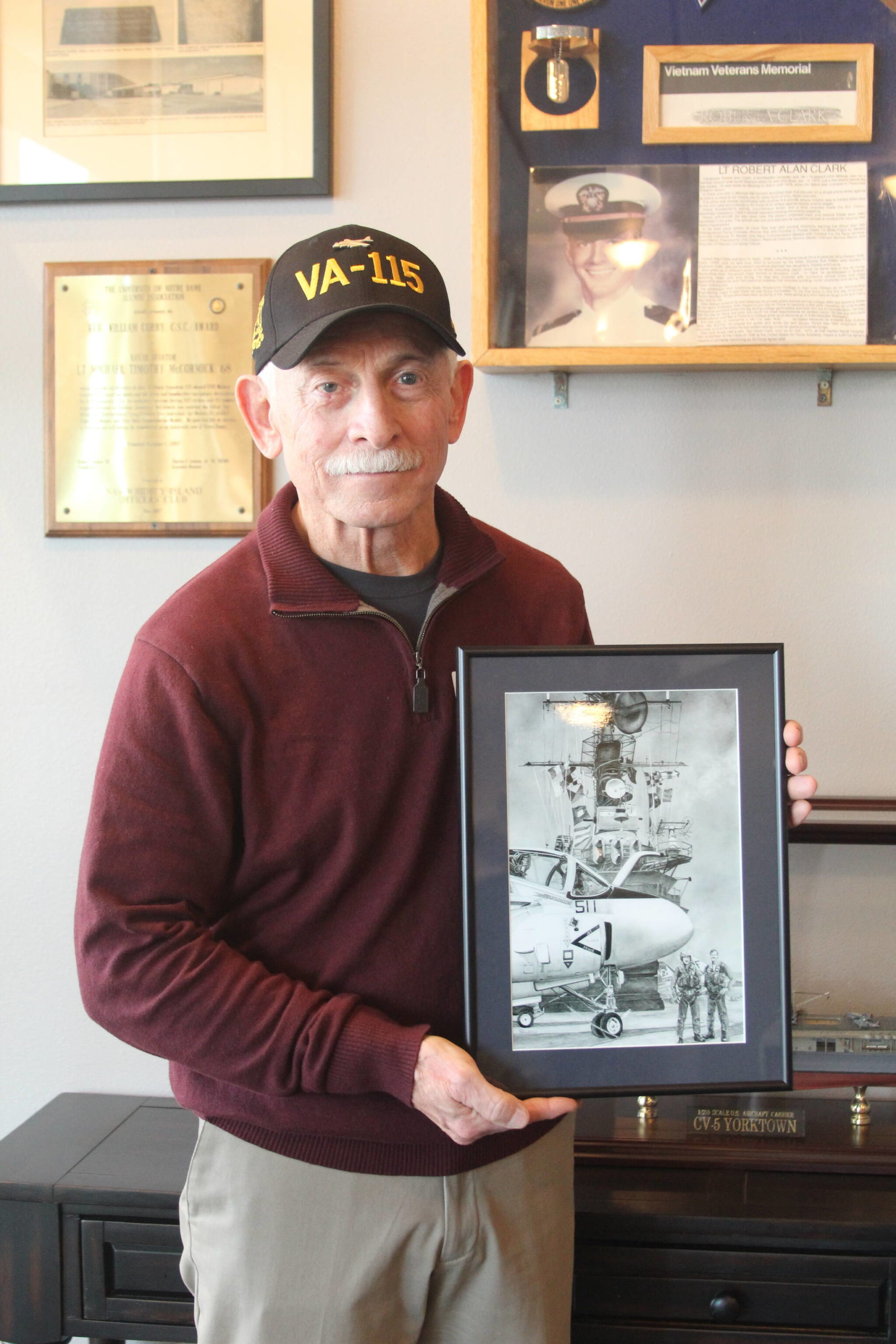 Photo by Karina Andrew/Whidbey News-Times
Former VA-115 member Rod Maskew gifts a painting he found of the last U.S. air crew lost in the Vietnam War to NAS Whidbey Island.
