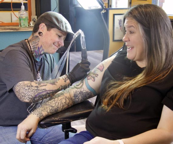 Photo by Rachel Rosen/Whidbey News-Times
Molly Vigallon tattoos Molly Waterbury in Nite Owl’s new location. Vigallon has been working at Nite Owl for eight years.