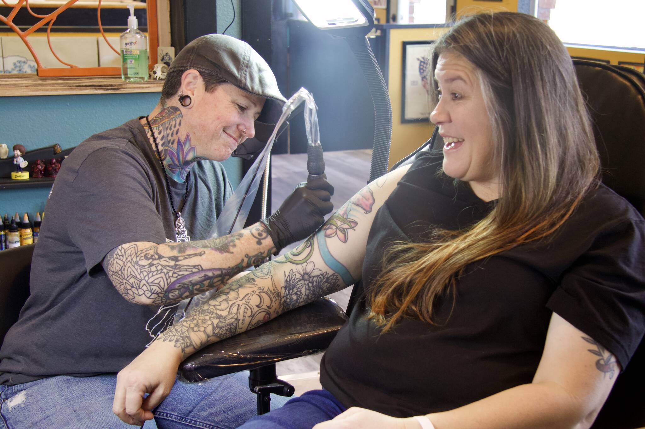 Tattoo shop moves, expands after decade