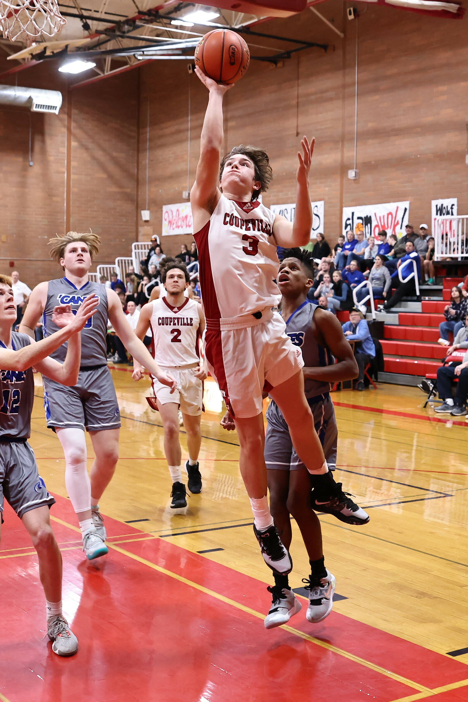 Coupeville junior Logan Downes takes a shot in a varsity basketball game against Mount Vernon Christian on Tuesday. Downes scored a total of 28 points for the Wolves during the Jan. 10 game. The Wolves won 44-39, bringing their record to 6-5 for the season. (Photo by John Fisken)