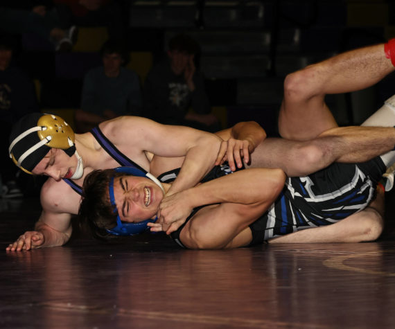 Photo by John Fisken
Oak Harbor athelte Percie Hatfield pins an oppnent at a Jan. 17 wrestling match aginst South Whidbey. The boys varsity wrestling team won 55-24.
“South Whidbey was a great match for us. The Falcons challenged us at a lot of our stronger weight classes, winning some matches against our better wrestlers,” said head coach Perer Esvelt. “Our communities are close when it comes to wrestling, so seeing a competitive match between us is great, as we can partner in the off-season and see both teams improve.”