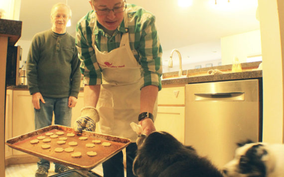 Photo by Karina Andrew/Whidbey News-Times
Arjai Allred puts some homemade dog treats in the oven to bake.