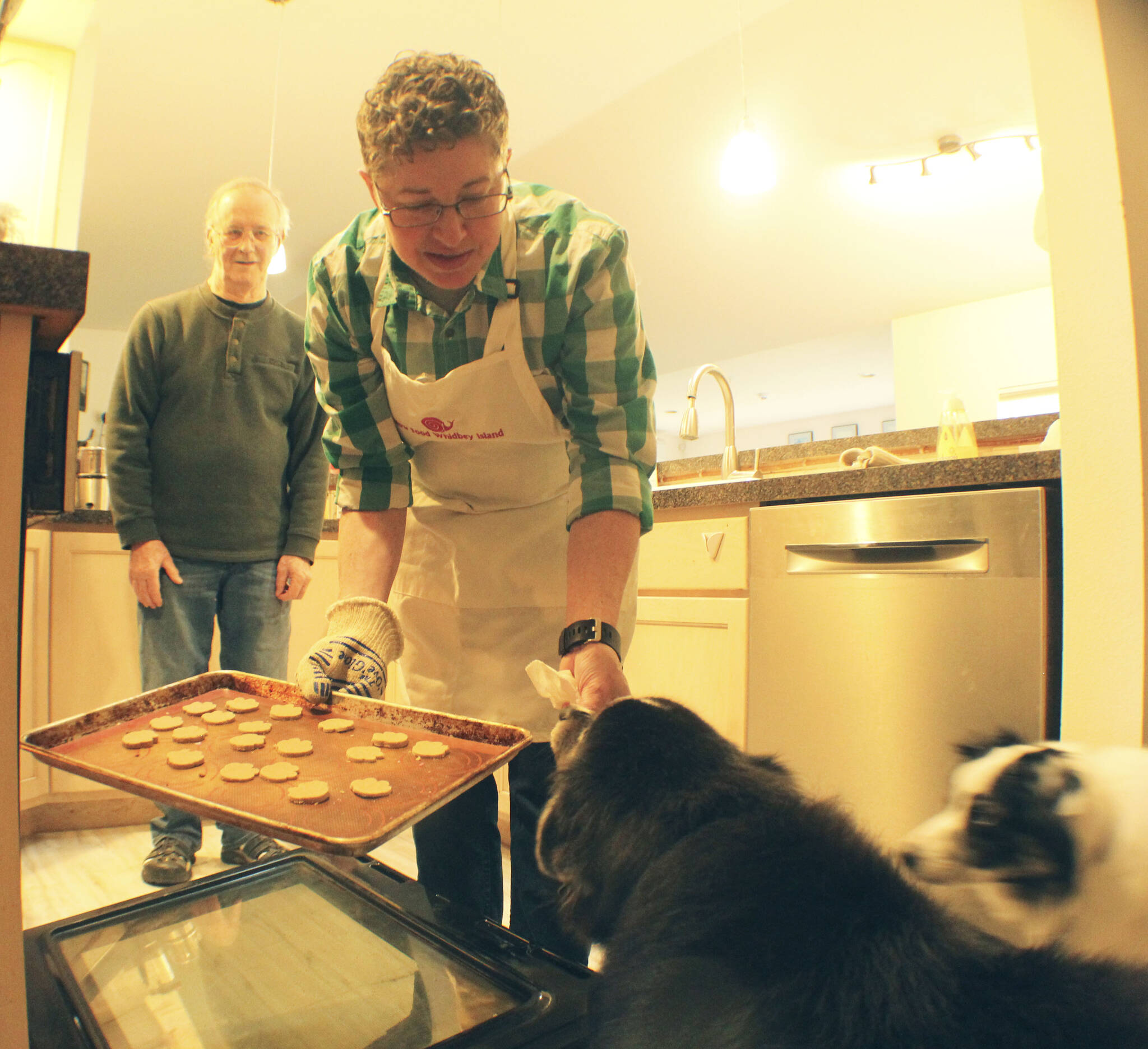 Photo by Karina Andrew/Whidbey News-Times
Arjai Allred puts some homemade dog treats in the oven to bake.