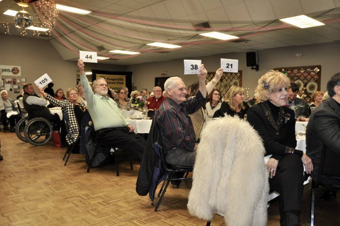 Attendees bid at a previous Coupeville Lions Club scholarship auction. (Photo provided)