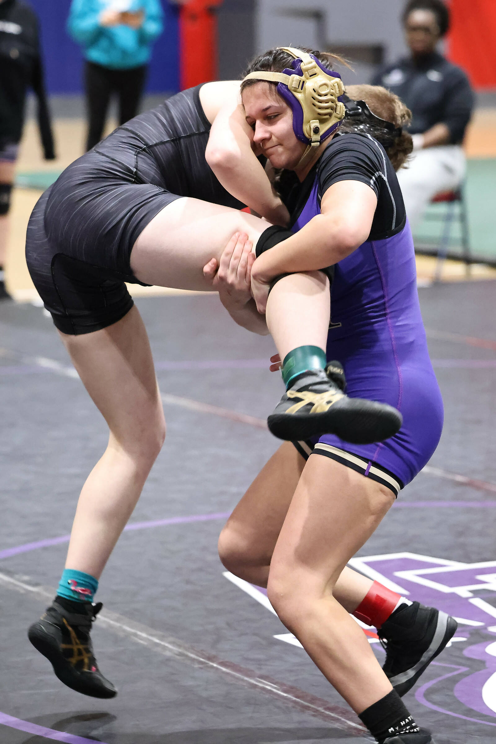 Photo by John Fisken
Oak Harbor athlete Kayla Bodenhafer (right) in a match at the sub-regional tournament Feb. 3. Bodehafer placed 7th in her weight class and will compete as an alternate in regionals.