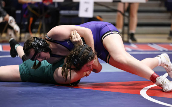 Photo by John Fisken
Zoe Beeman pins an opponent at the sub-regional tournament Feb. 3. Beeman placed second in her weight class and qualified for the regional tournament Saturday.
