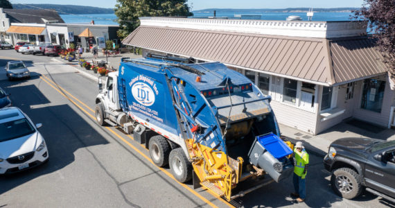 Photo provided
An Island Disposal truck services Village Pizzeria in downtown Langley.