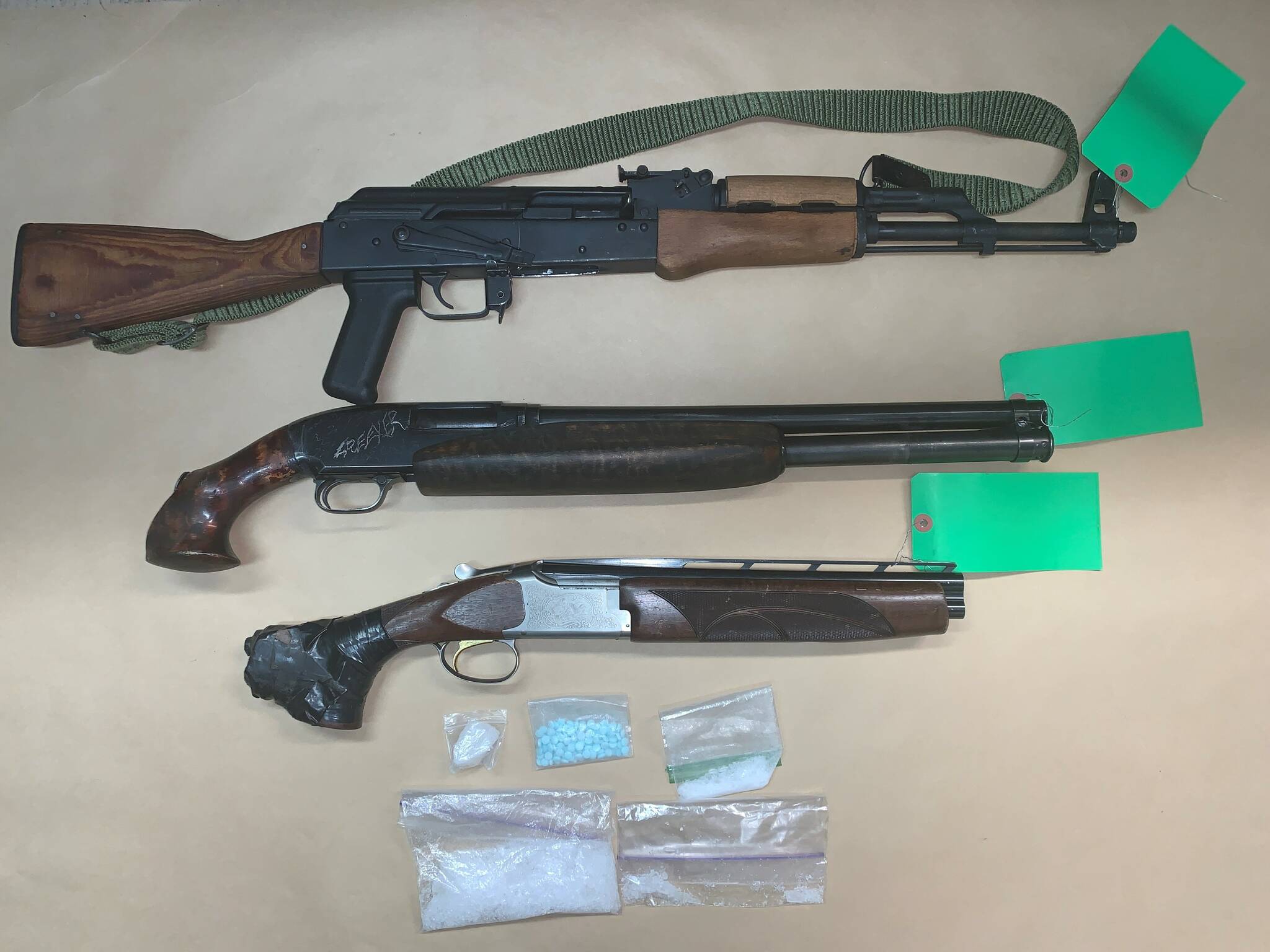 Oak Harbor police searched two cars and discovered sawed-off shotguns, an AK-47, meth and fentanyl. (Oak Harbor police image)