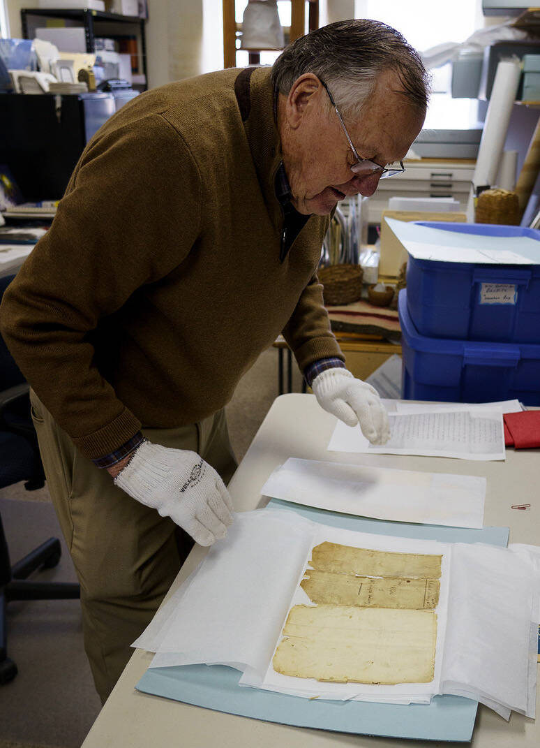 Photo by David Welton
South Whidbey Historical Society President William Haroldson handles Joseph Whidbeys original will with cotton gloves.