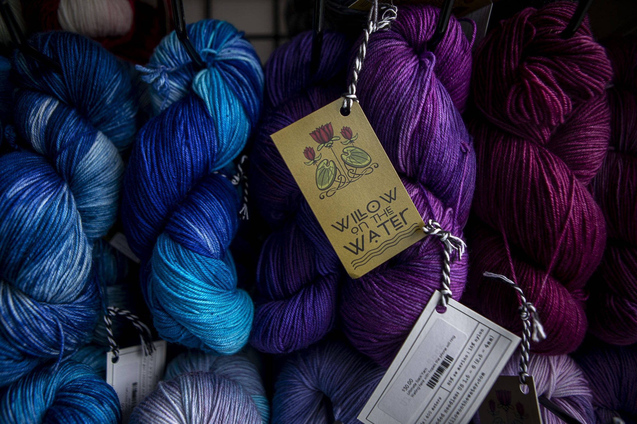 Yarn dyed by Willow Mietus, 50, hangs inside “The Wool Wagon.”