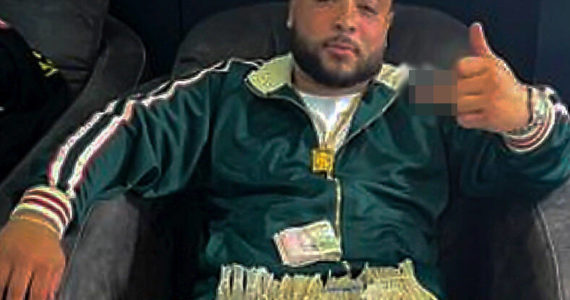 Courtesy of FBI
Federal agents obtained a “selfie” photo of Bryce Hill with piles of cash through a search warrant of his phone.
