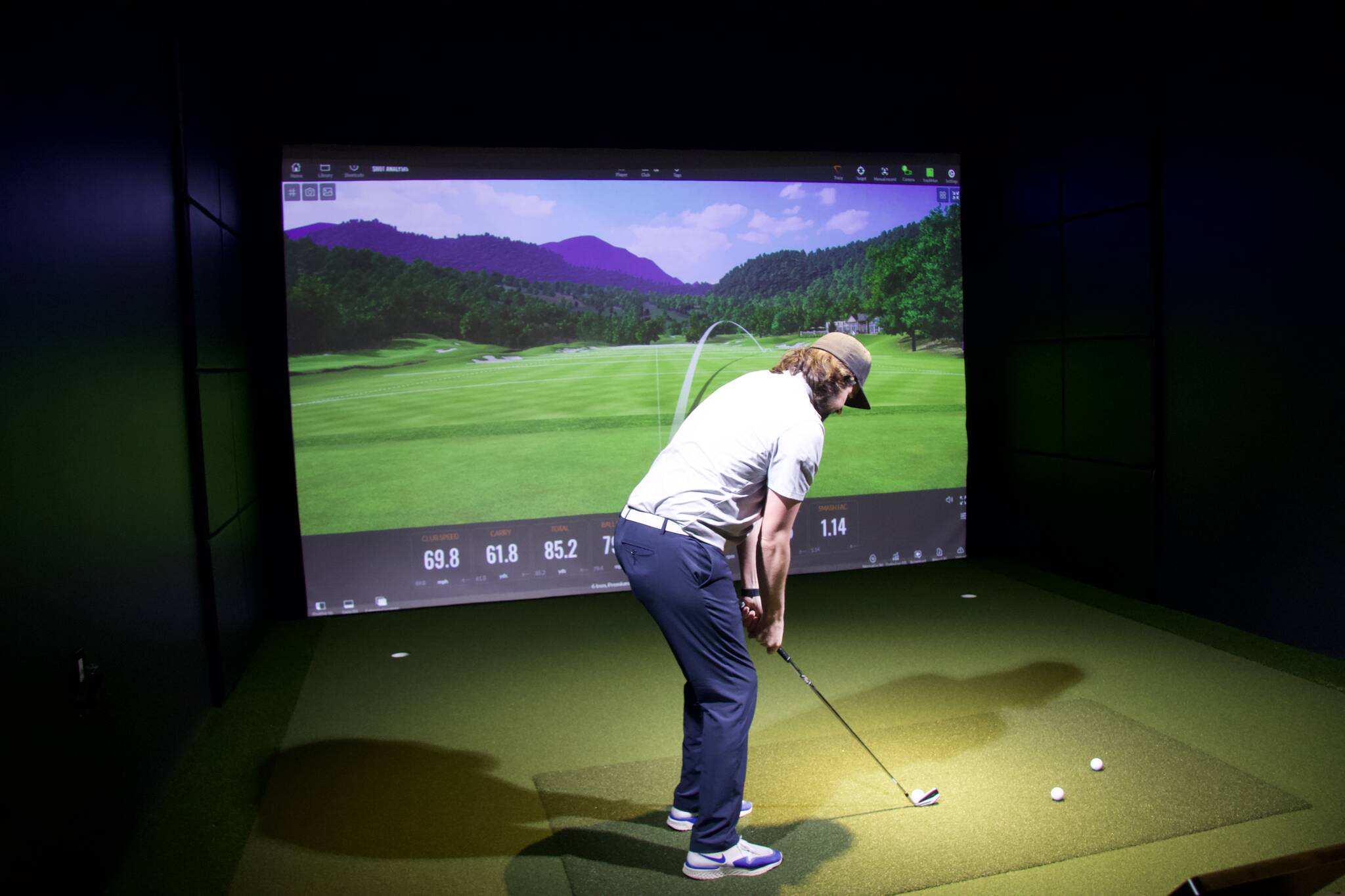 Photo by Rachel Rosen/Whidbey News-Times
Puget Sound golf Club owner Josh Ray takes a swing using the golf simulator.