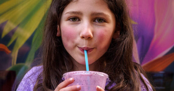 Photo by David Welton
Willow Skaggs, 7, enjoys a drink from TONIC Juice & Remedy, a new business in downtown Langley.