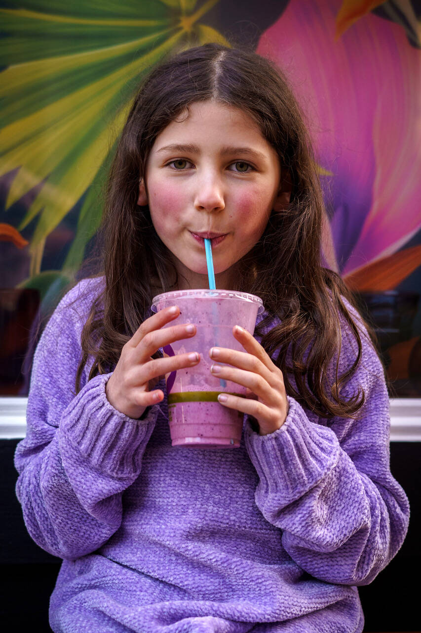 Photo by David Welton
Willow Skaggs, 7, enjoys a drink from TONIC Juice & Remedy, a new business in downtown Langley.