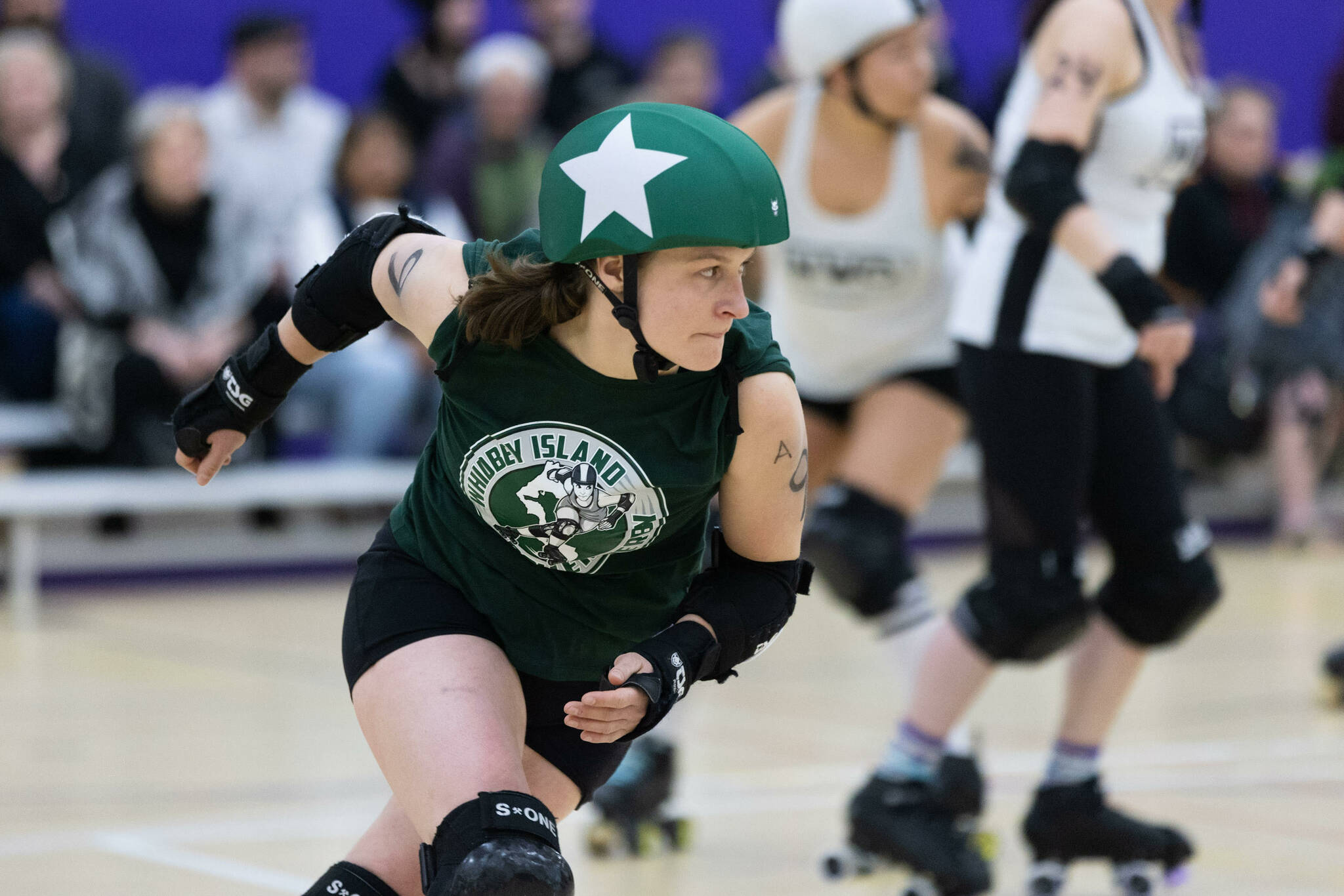 Whitni “Wild Sockeye” Schurr skates in a Whidbey Island Roller Derby bout March 11.