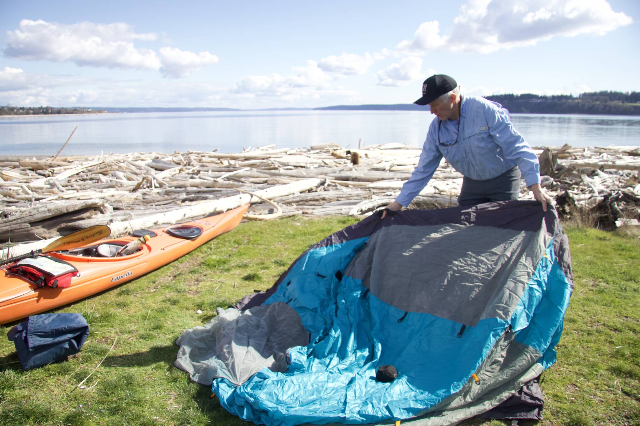 Photo by Rachel Rosen/Whidbey News-Times
Bill Walker demonstrates setting up camp at Windjammer Park’s water camping site.