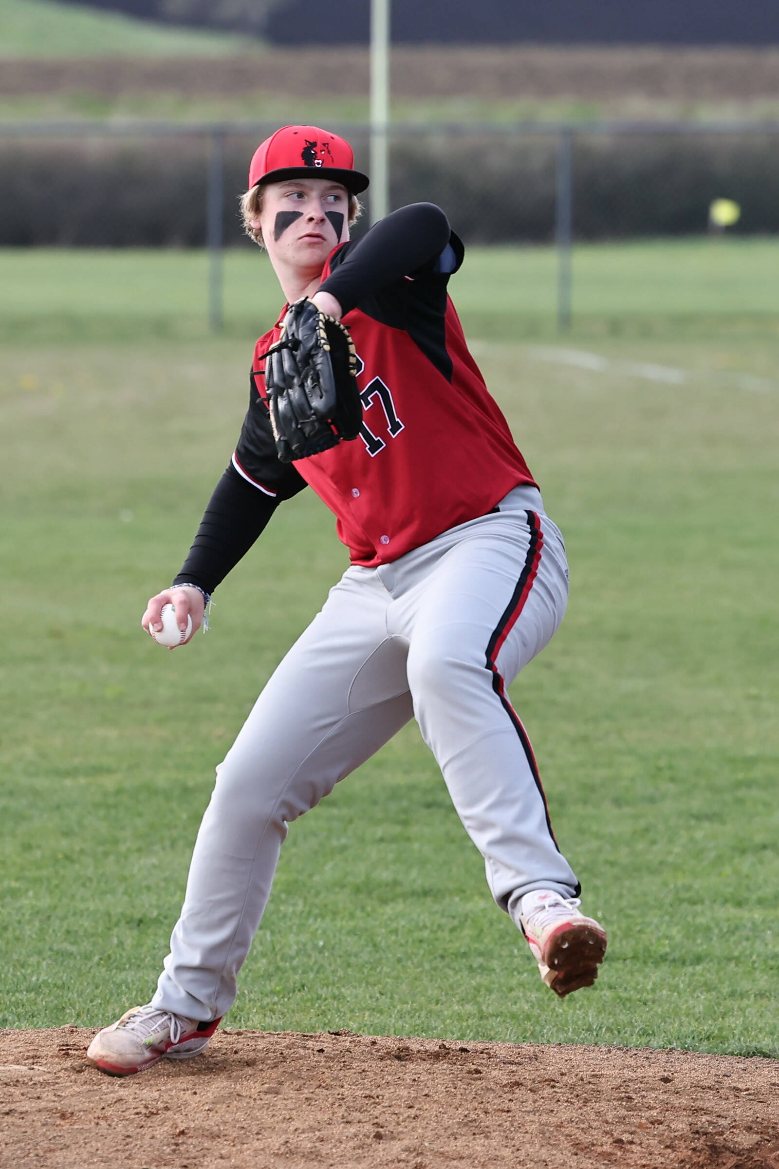 Coupeville freshman Camden Glover pitches in a baseball game against visiting Darrington High School April 11. The Wolves won 10-0. (Photo by John Fisken)