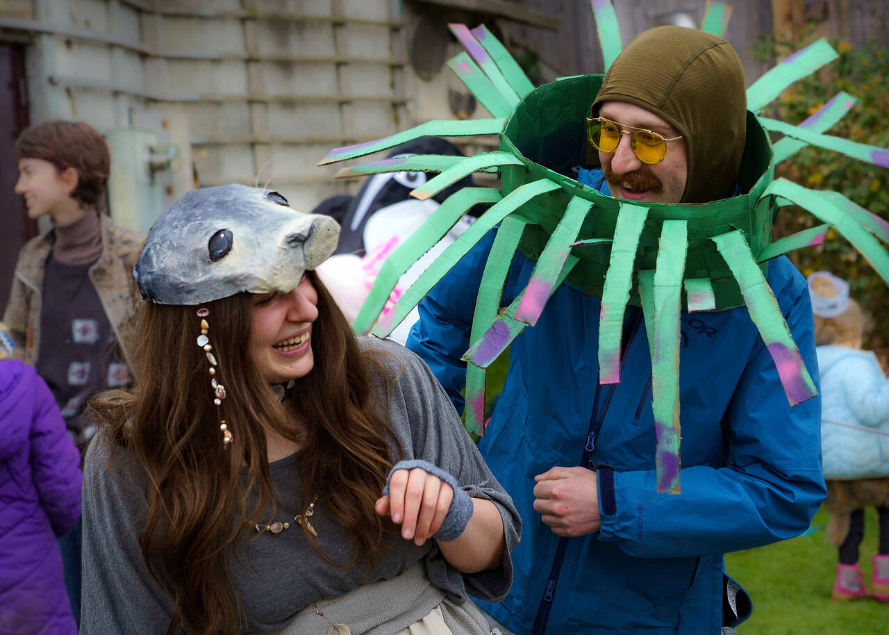 Heather Talley helped kids make seal costumes for the parade and Sean Adair dressed as a sea anemone.