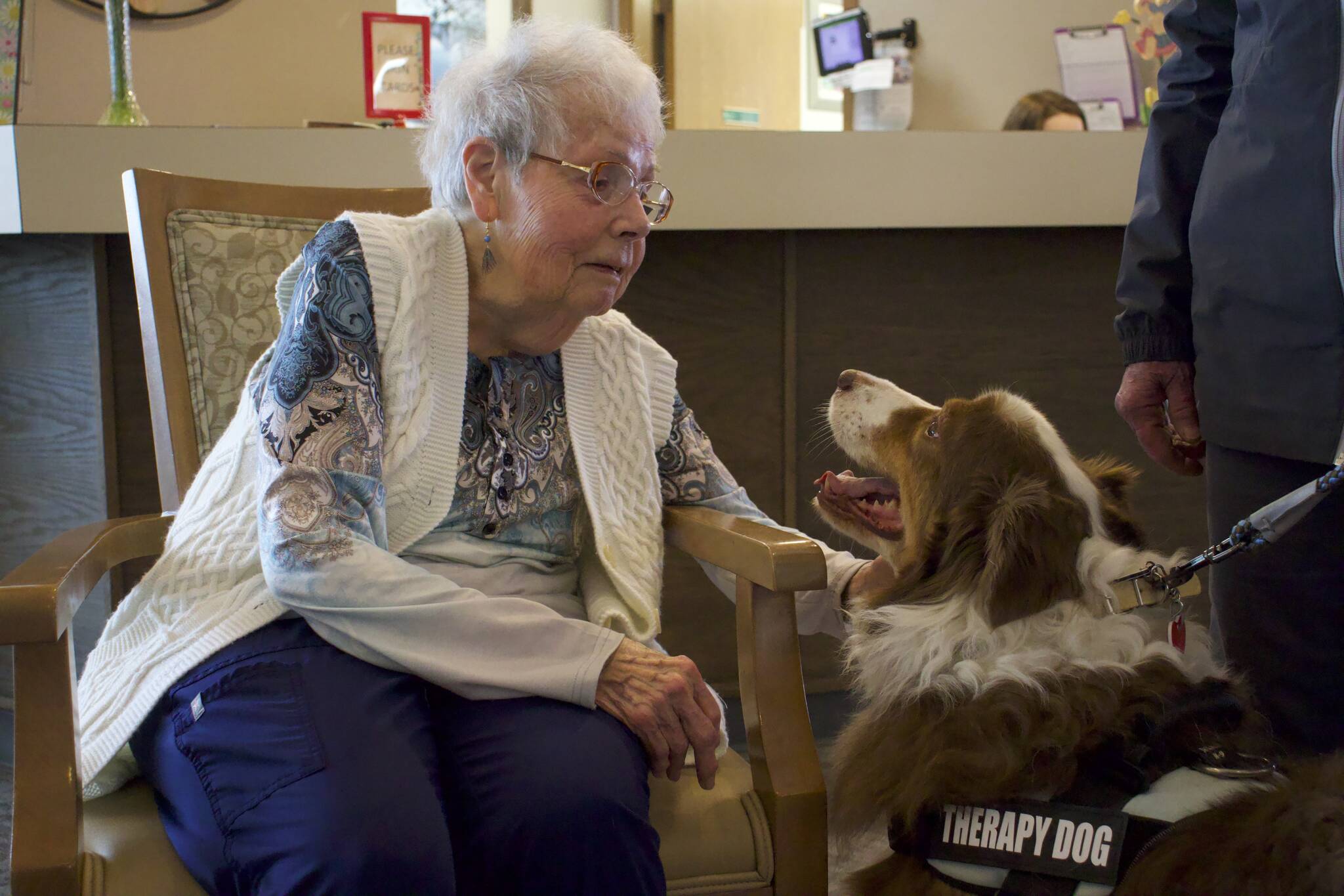 Photo by Rachel Rosen/Whidbey News-Times
Harriet Dailey, a resident at Harbor Tower Village, pets a therapy dog.