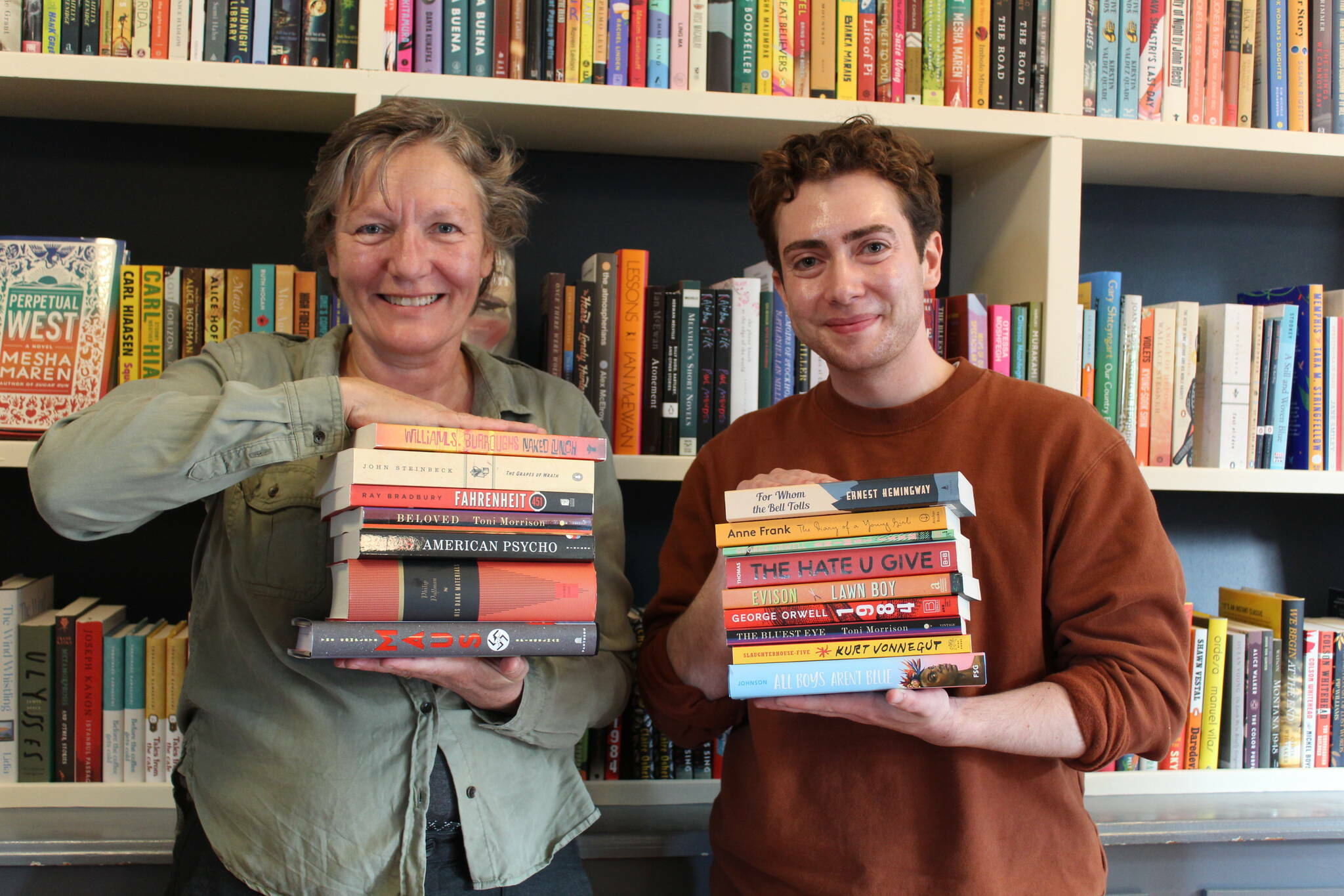 File photo by Karina Andrew/Whidbey News-Times
Meg Olson and Felix Hall show off just a few of the titles, both classic and contemporary, available at Kingfisher Bookstore in Coupeville.