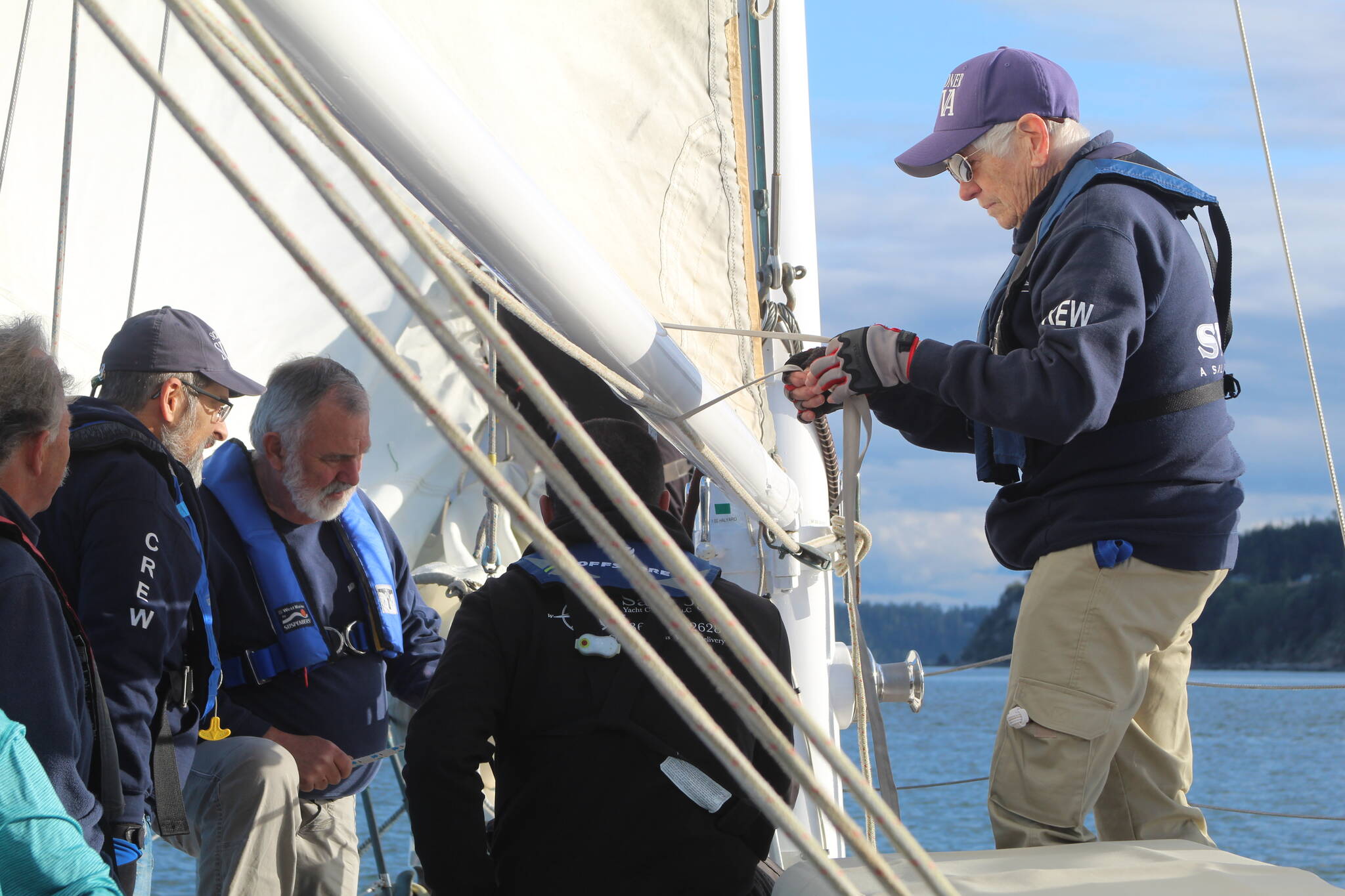Volunteer crew members practice their various duties during a training sail on the Suva April 24. (Photo by Karina Andrew/Whidbey News-Times)