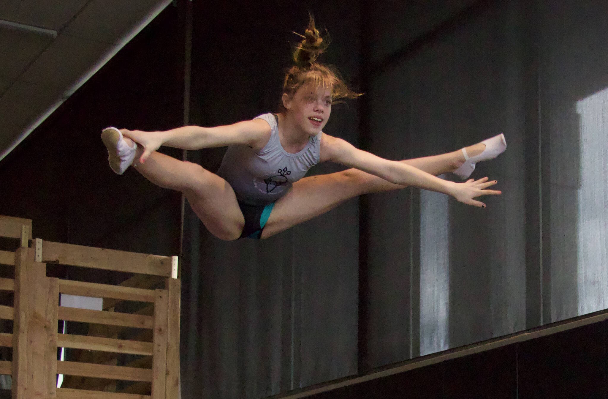 Malaina Yargo, 14, straddle jumps on a trampoline. Yargo is a national qualifier in double mini. (Photo by Rachel Rosen/Whidbey News-Times)