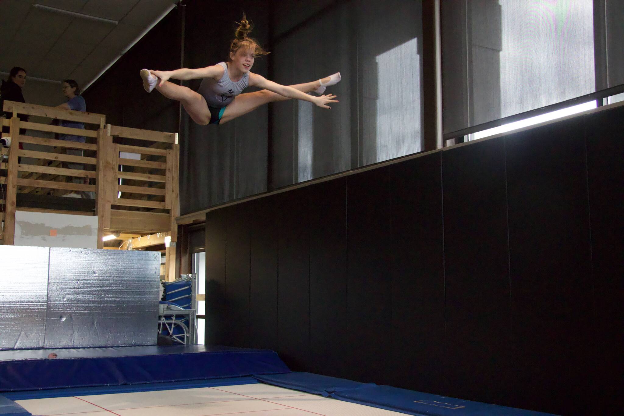 Malaina Yargo, 14, straddle jumps on a trampoline. Yargo is a national qualifier in double mini. (Photo by Rachel Rosen/Whidbey News-Times)