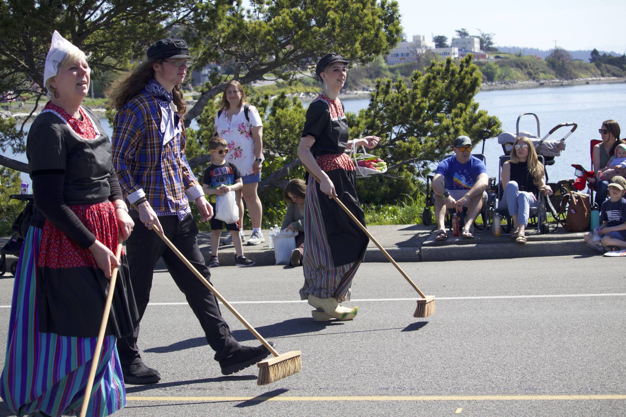 Photos by Rachel Rosen/Whidbey News-Times
People dressed in traditional Dutch clothing sweep the street.