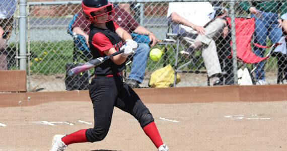 Photo by John Fisken
Haylee Armstrong, an eighth grader and starter on Coupeville High School’s varsity softball team, swings during a game against La Conner April 29. The Wolves won 17-2.