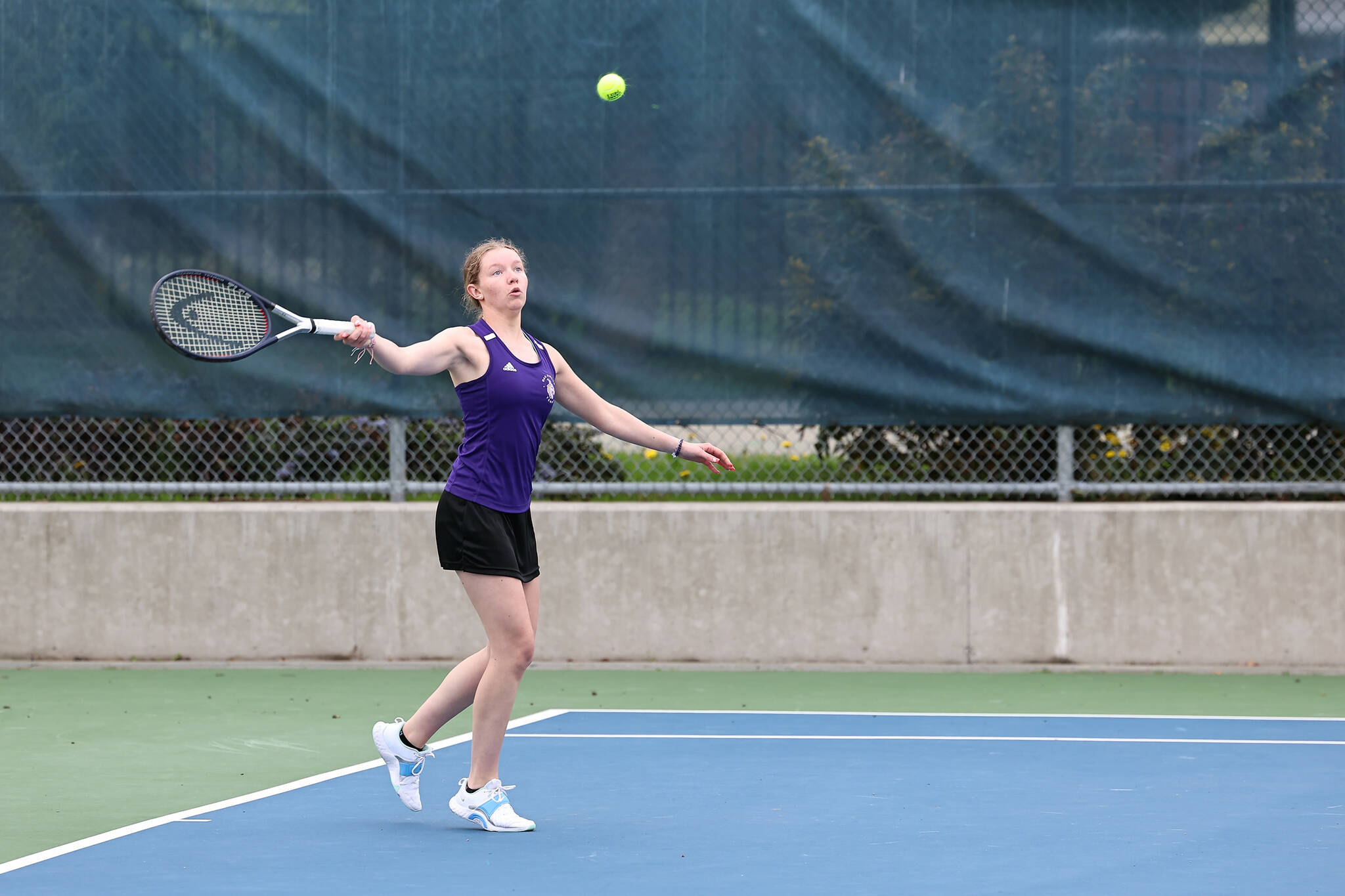 Oak Harbor athlete Anna Servatius lost fist doubles 0-6, 3-6 against Anacortes May 1. The Wildcats lost the match 3-4. (Photo by John Fisken)