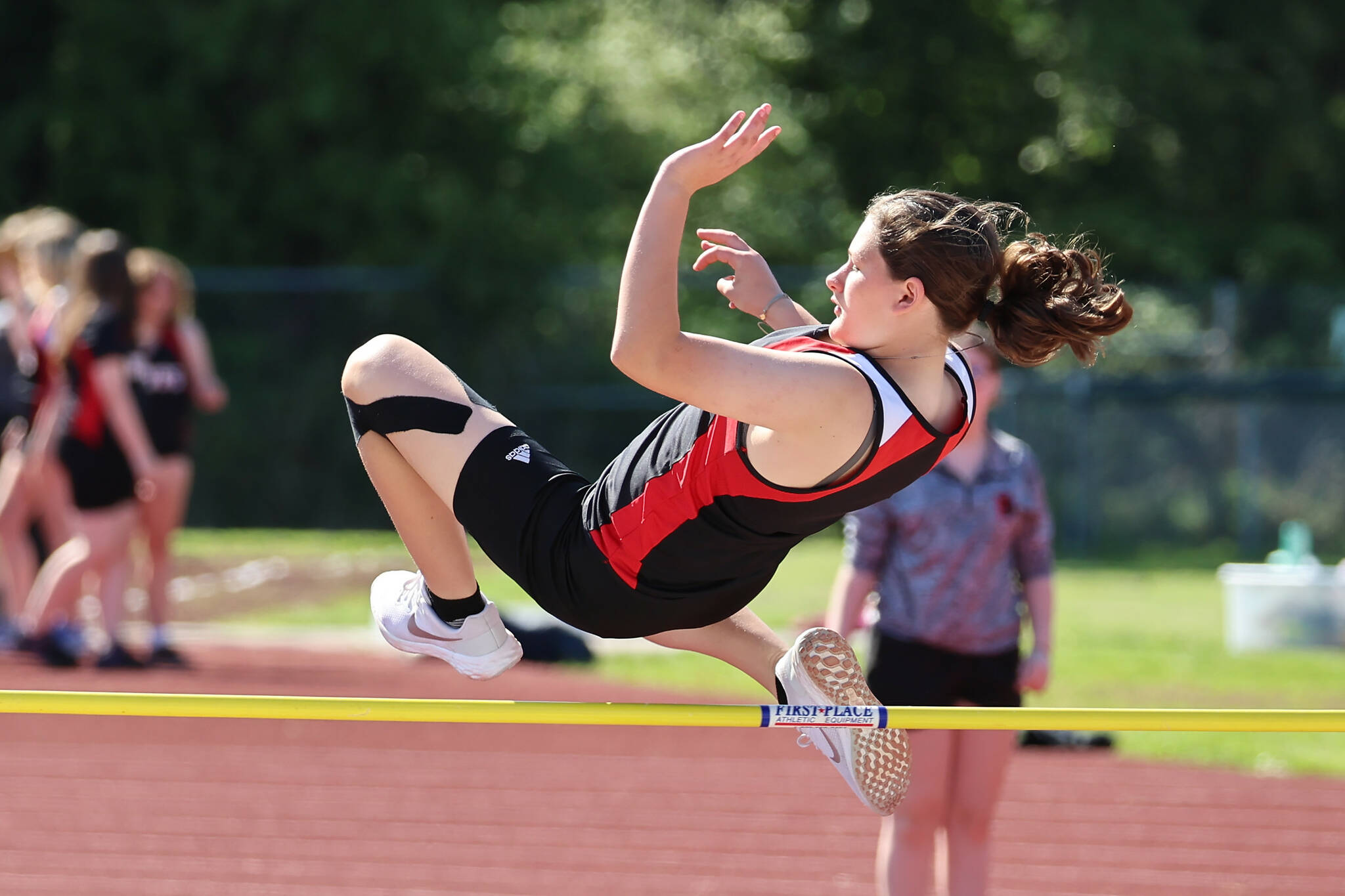 Sixth grader Tamsin Ward takes on the high jump. (Photo by John Fisken)