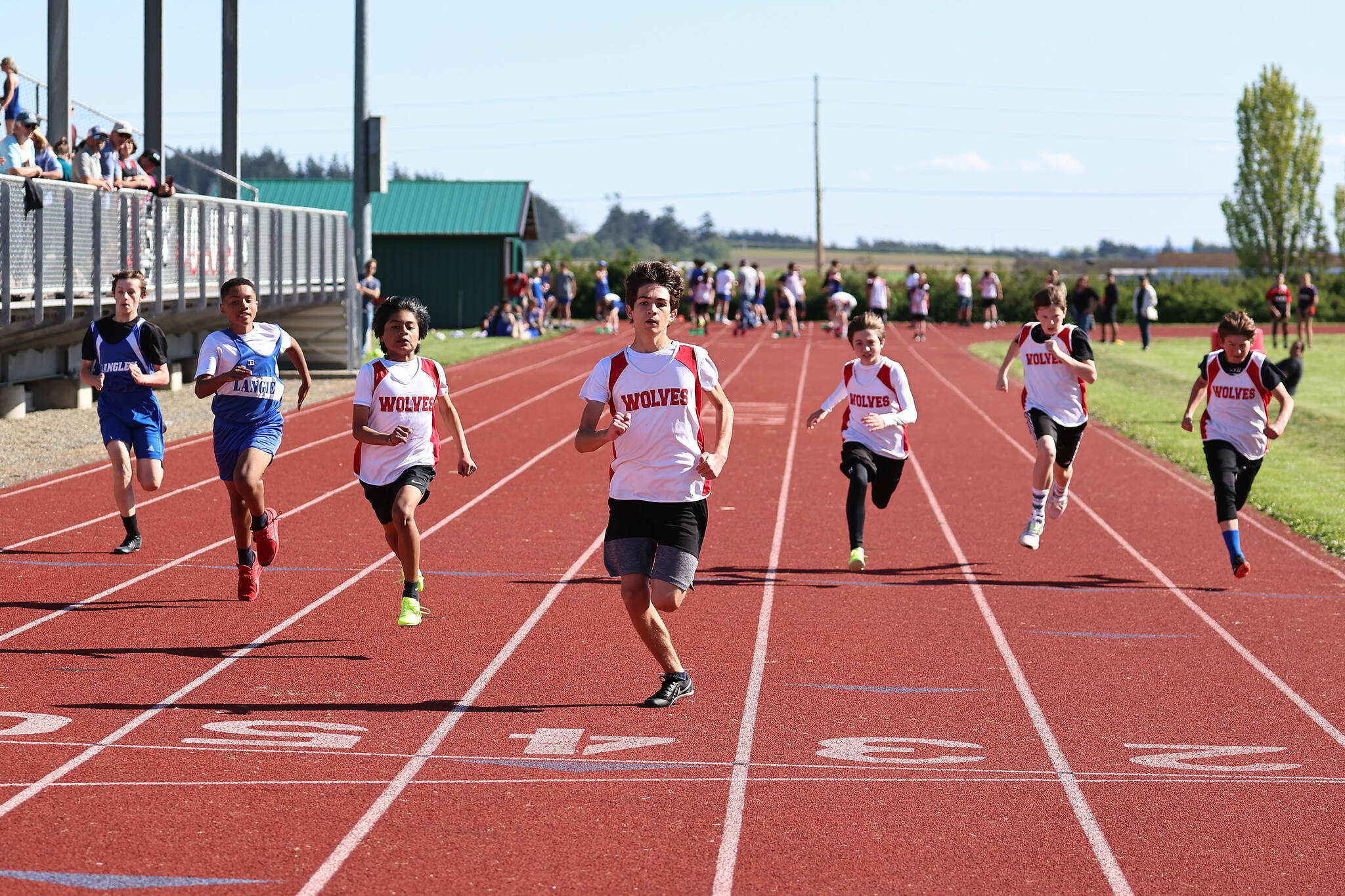From left, Coupeville Middle School seventh graders Roger Merino-Martinez, Beckett Green, Leo Rodriguez, Carson Grove and Wyatt Fitch-Marron race at a track meet Wednesday. (Photo by John Fisken)