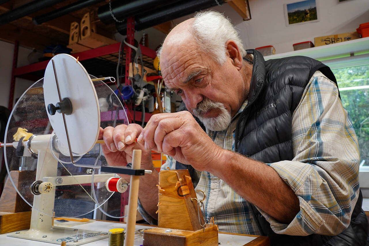 Jon Lyman works on a segment of a fly fishing rod in his workshop. For nearly 25 years, Lyman has built custom bamboo rods that honor of legacy of anglers.