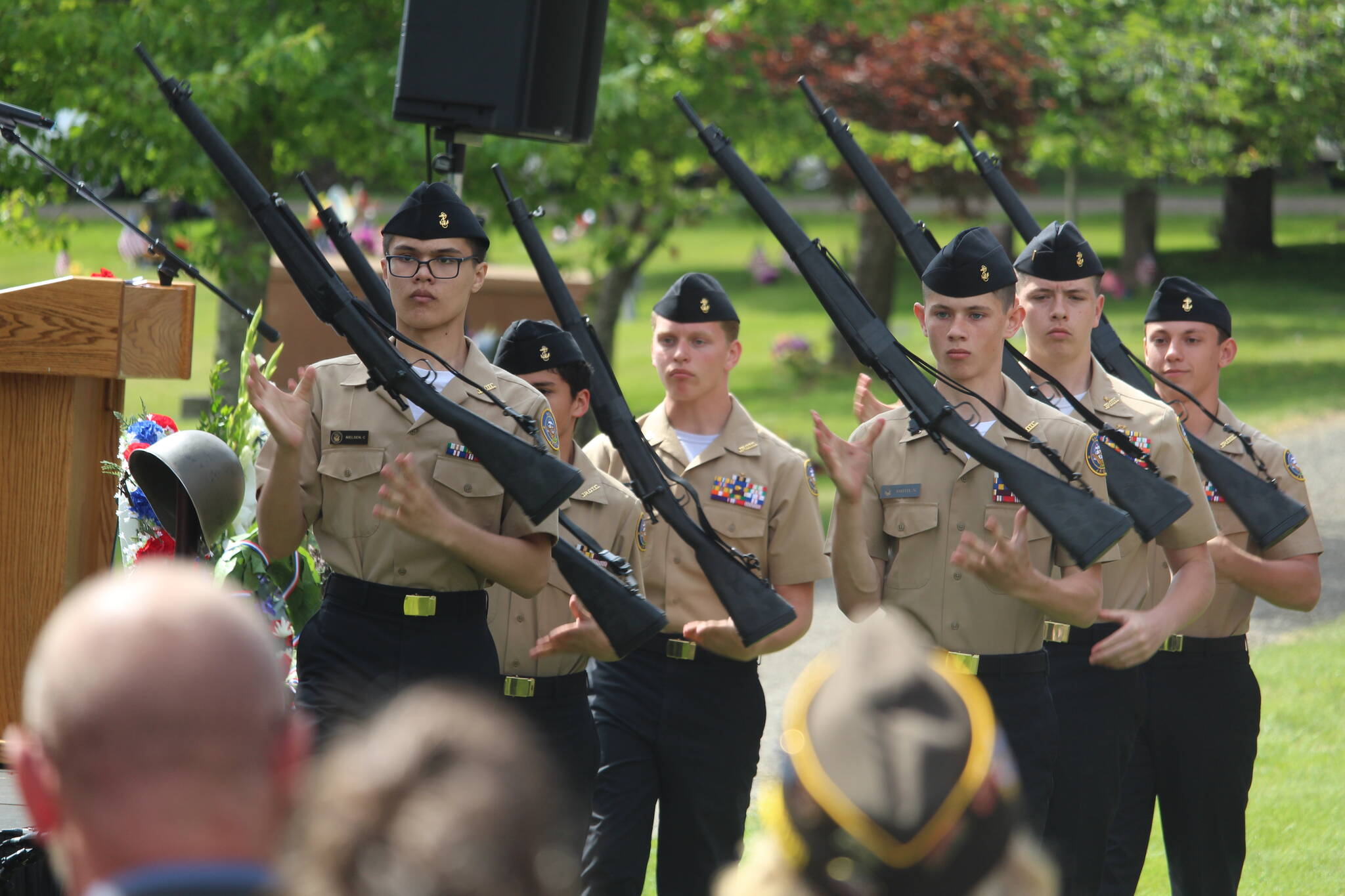 Photo by Karina Andrew/Whidbey News-Times
Oak Harbor High School's NJROTC armed drill team performs at Maple Leaf Cemetery on Memorial Day.
