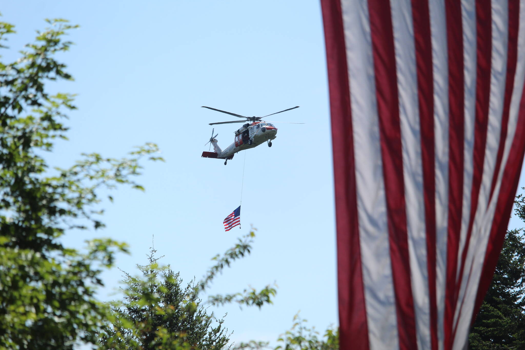 Photo by Karina Andrew/Whidbey News-Times
An NAS Whidbey Island Search and Rescue helicopter executes a flyover at the conclusion of the Service of Remembrance on Memorial Day.