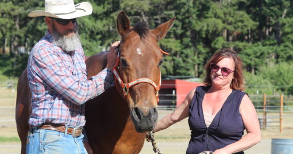 Photo by Karina Andrew/Whidbey News-Times
Doug and Alexis Mills stand with Django.