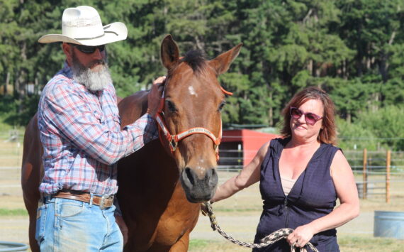 Photo by Karina Andrew/Whidbey News-Times
Doug and Alexis Mills stand with Django.