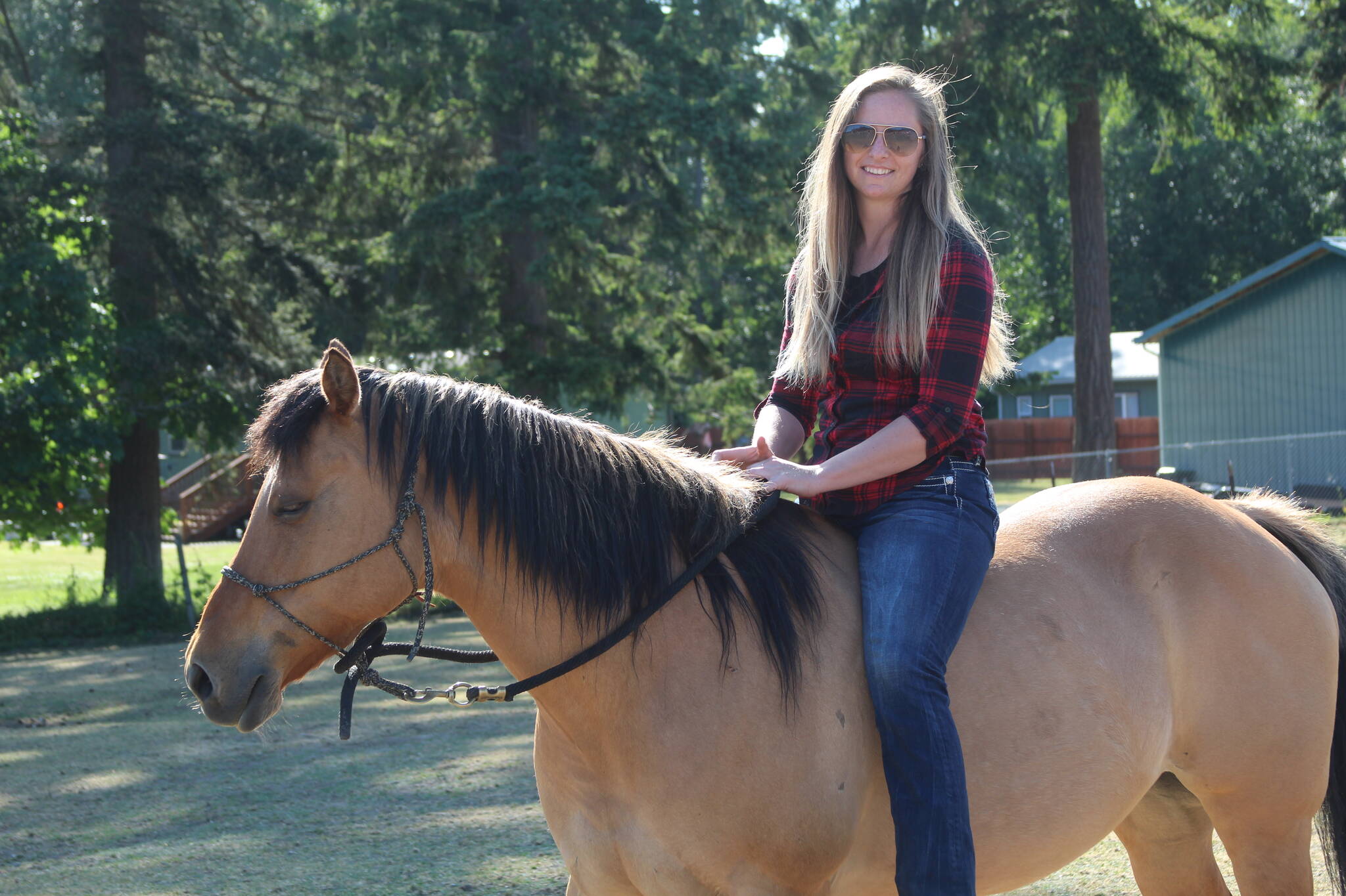 Photo by Karina Andrew/Whidbey News-Times
Shannon Ivins rides her horse, Apache.