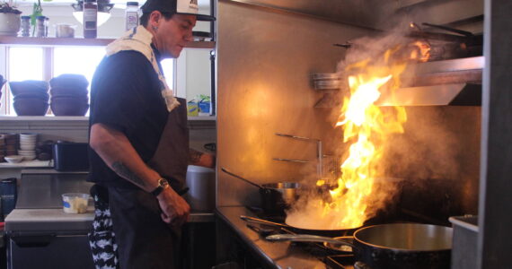 Photo by Karina Andrew/Whidbey News-Times
Ben Jones heats things up in the kitchen at Oystercatcher.