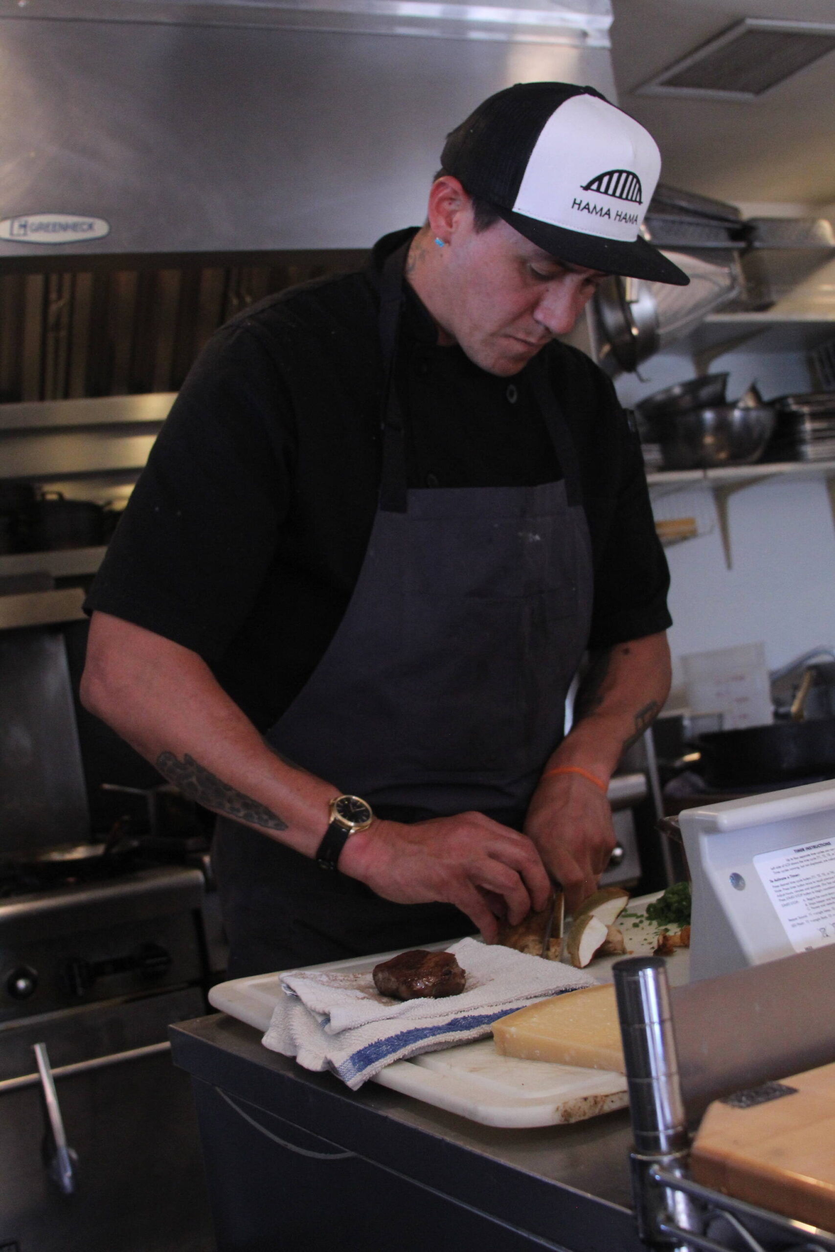 Photo by Karina Andrew/Whidbey News-Times
Ben Jones prepares ingredients for a meal at Oystercatcher.