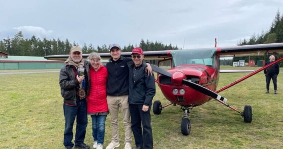 Photos provided
 From left, Fred Lundahl, Nydia Blood, Rowen Stephens and Peter Morton stand in front of a little red plane named Scarlett. The photo was taken after Stephens earned an instructor’s license.